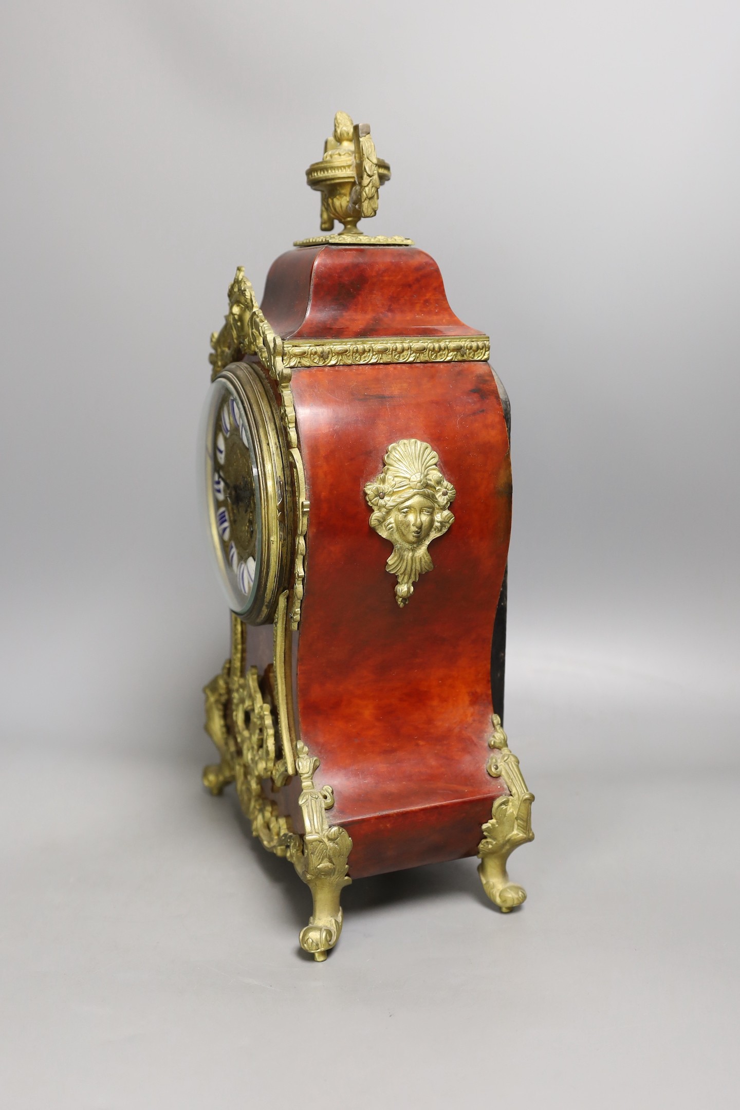 A late 19th century French scarlet tortoiseshell and ormolu mounted mantel clock - 40cm tall
